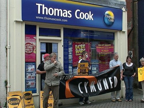 Cymuned Protesting outside a Thomas Cook Travel Agent.