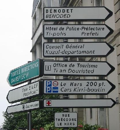 Some bilingual road signs in Breizh. The Breton language on some such signs has been sprayed out in the past.