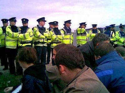 Protesters surrounded by police in a Shell to Sea standoff