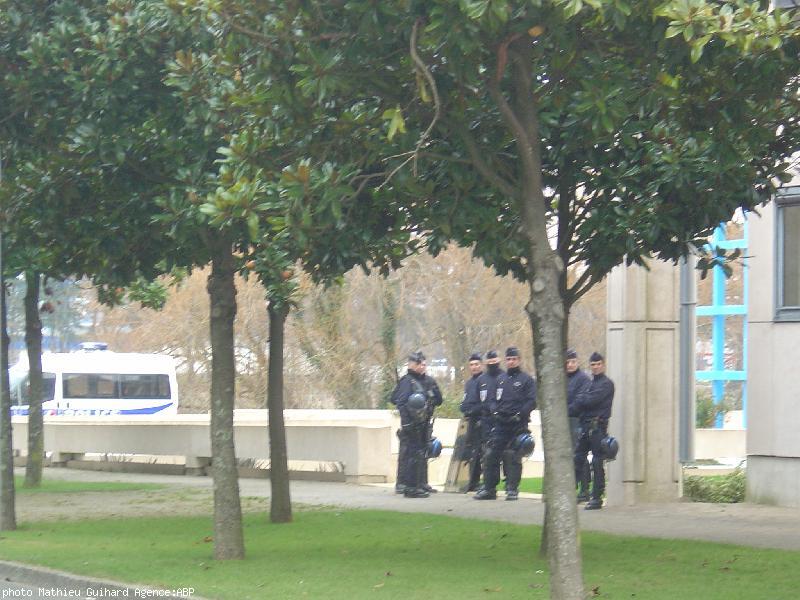 Anti-riot policemen were guarding the way to the back of the main building  far away from the demonstraters.