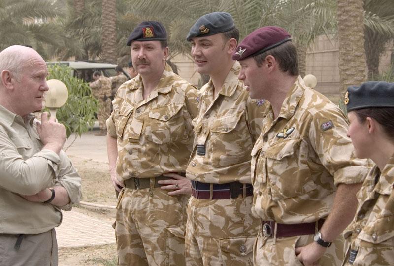 John Reid (above left) meeting troops in Baghdad