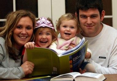 A family learning the Weslh language above (photo: University of Glamorgan)